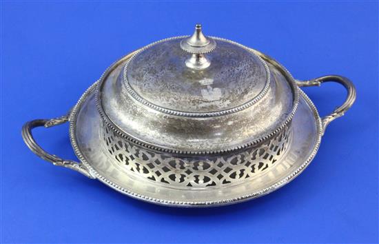 A Victorian pierced silver circular two-handled butter dish and cover, 11.5 oz.